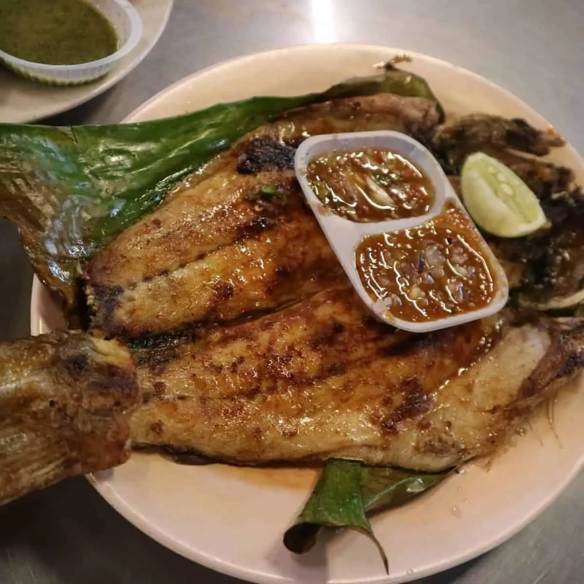 Grilled fish with assam sauce at Batu Ferringhi Night Market Penang