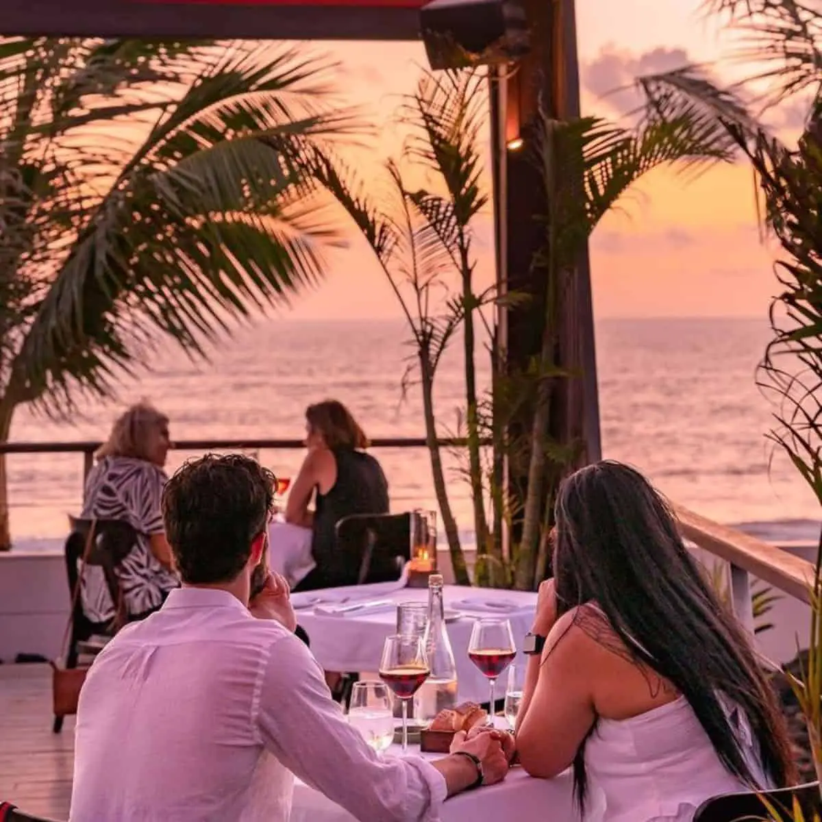 Ku De Ta bar couple romantic dinner facing the beach Seminyak