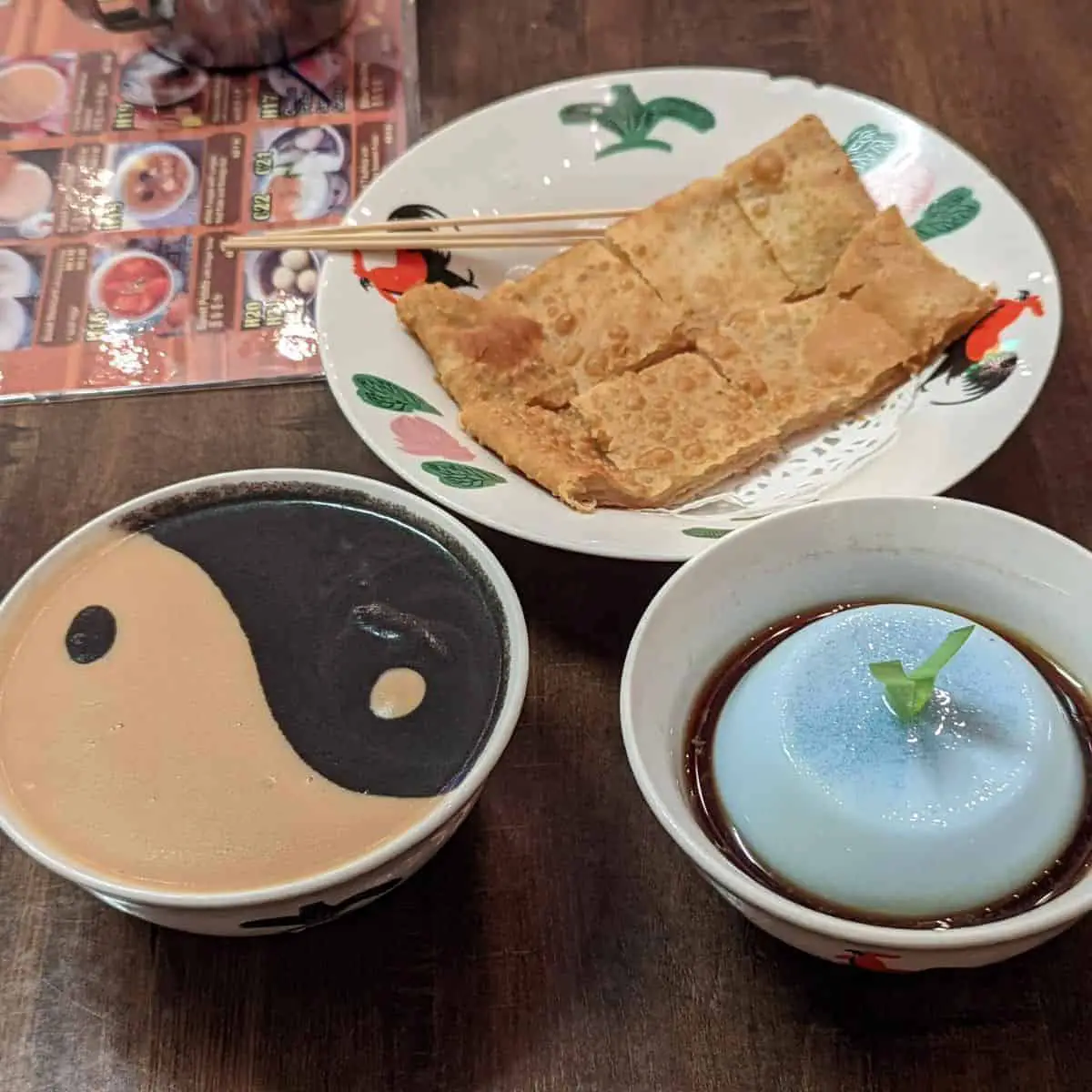 Peanut and black sesame soup, butterfly pea tofu, lotus paste pancake at Tong Sui Po