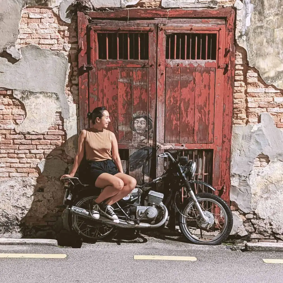 Penang nightlife things to do Lebuh Ah Quee Street Art by Ernest Zacharevic Boy on Motorbike, Victoria on the bike