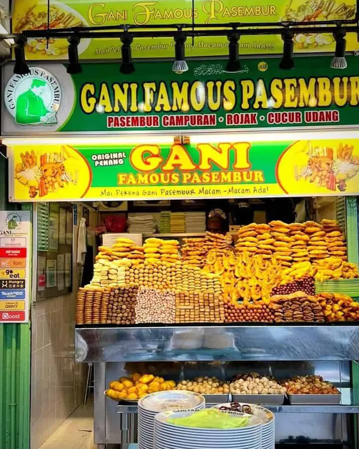 A front view photo of Gani Famous Pasembur stall with many Malaysian food on display