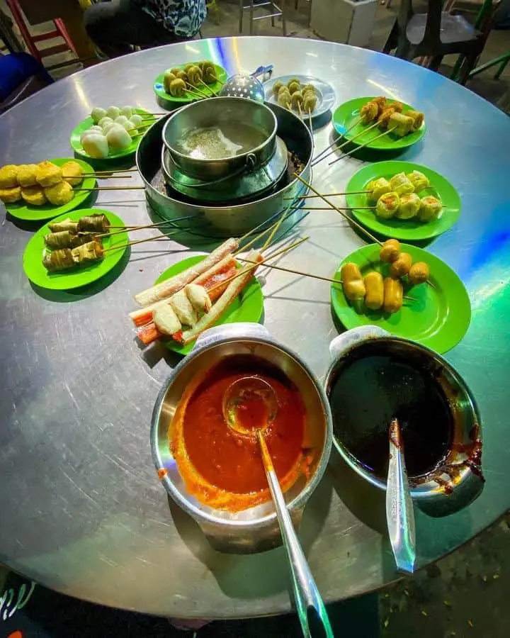 A table filled with local Malaysian food at Padang Brown food court