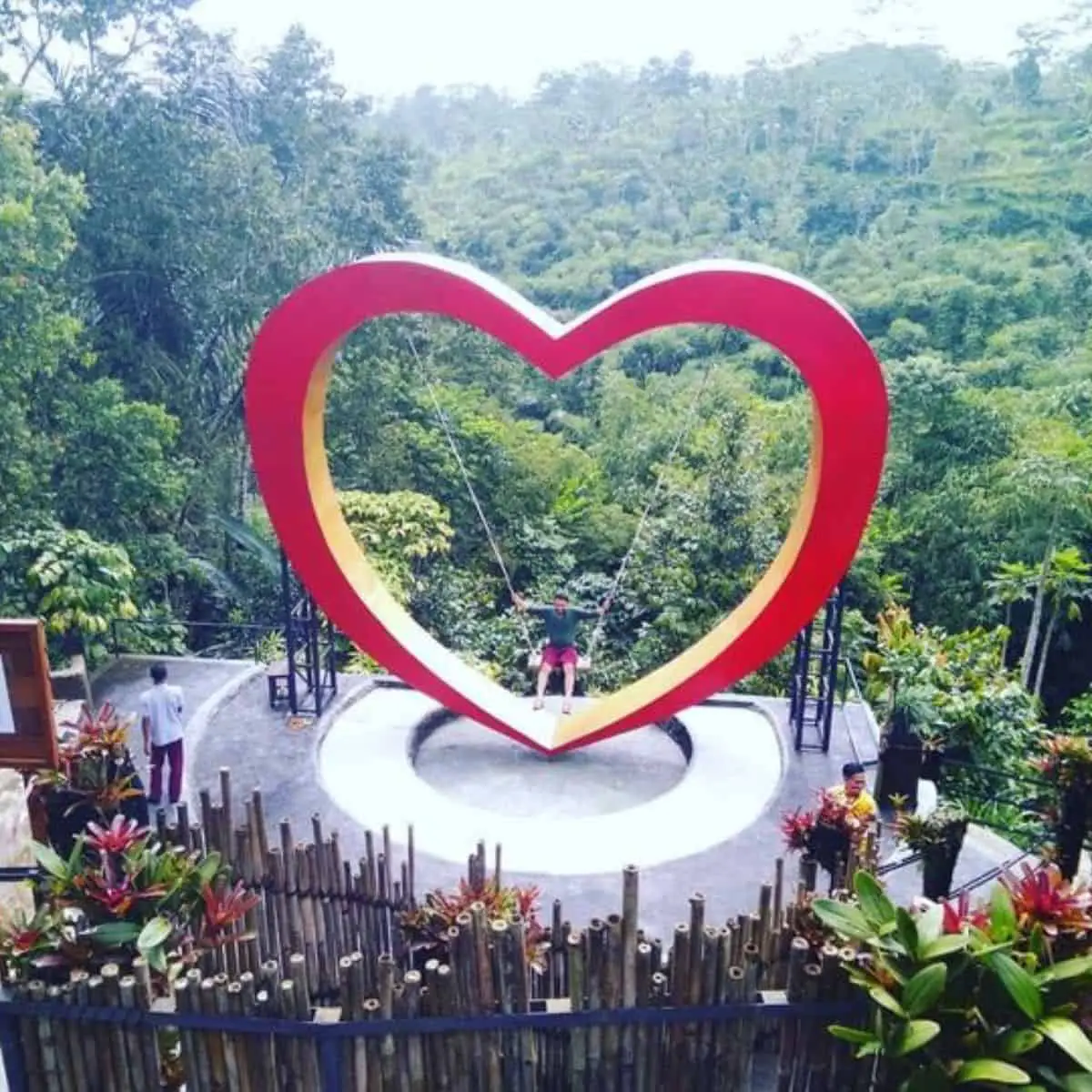 Bas De Atayana’s heart shaped swing with a forest background