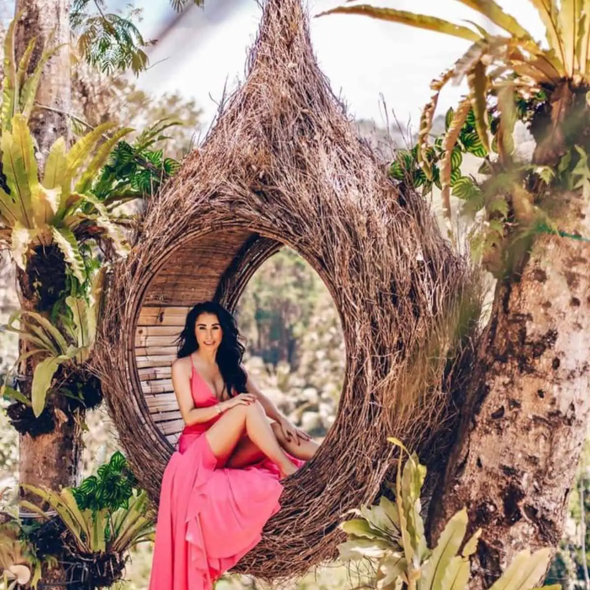 Gorgeous woman posing in Bali Swing Pioneer’s bird nest