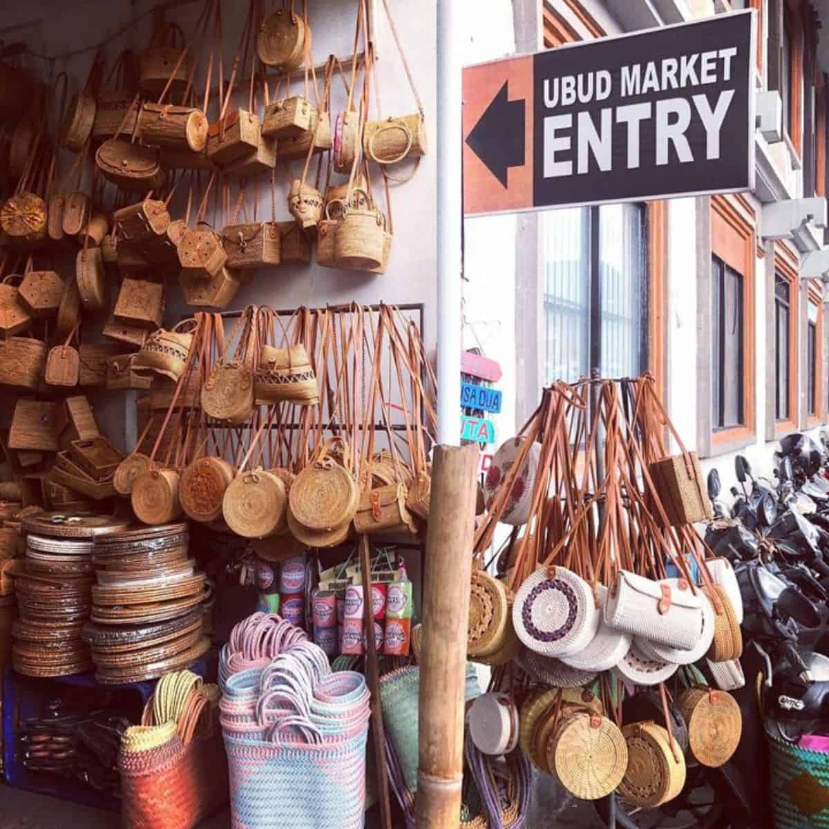 Handcrafted souvenir items with an Ubud Market entry signage