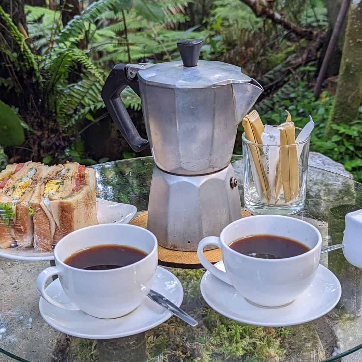 Kopi Hutan prepared in a mokapot with a side of club sandwich