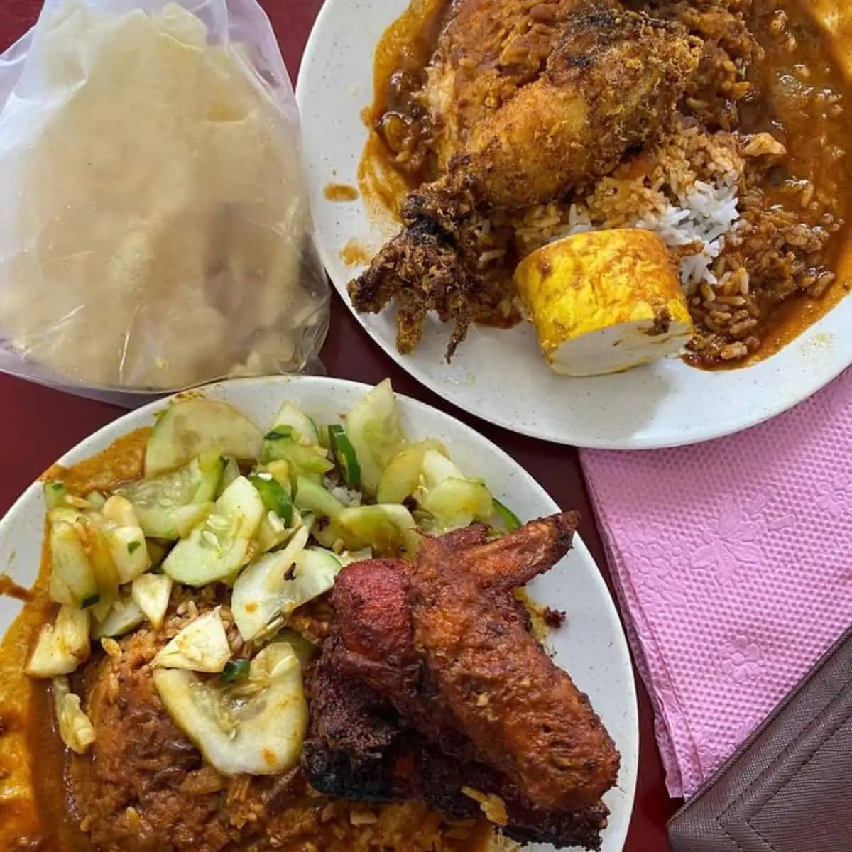 Full plate of Nasi Kandar from Deen Maju with a piece of chicken, sliced salted egg, and green veggie