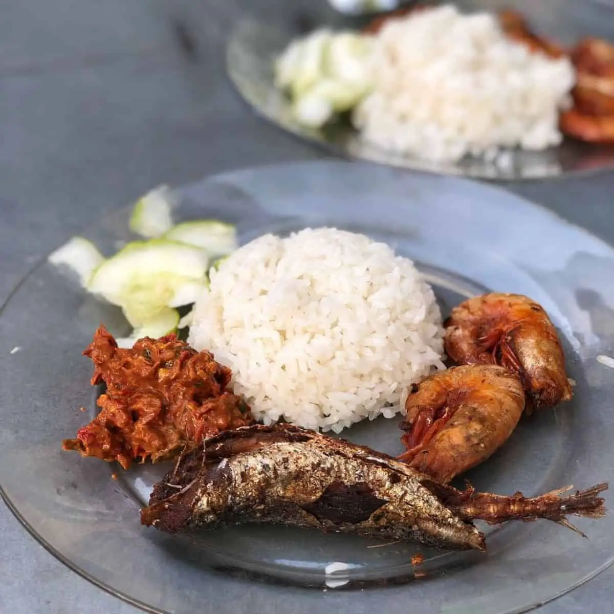 Jin Hoes Nyonya version of Nasi Lemak with fried fish, shrimp and sliced cucumber
