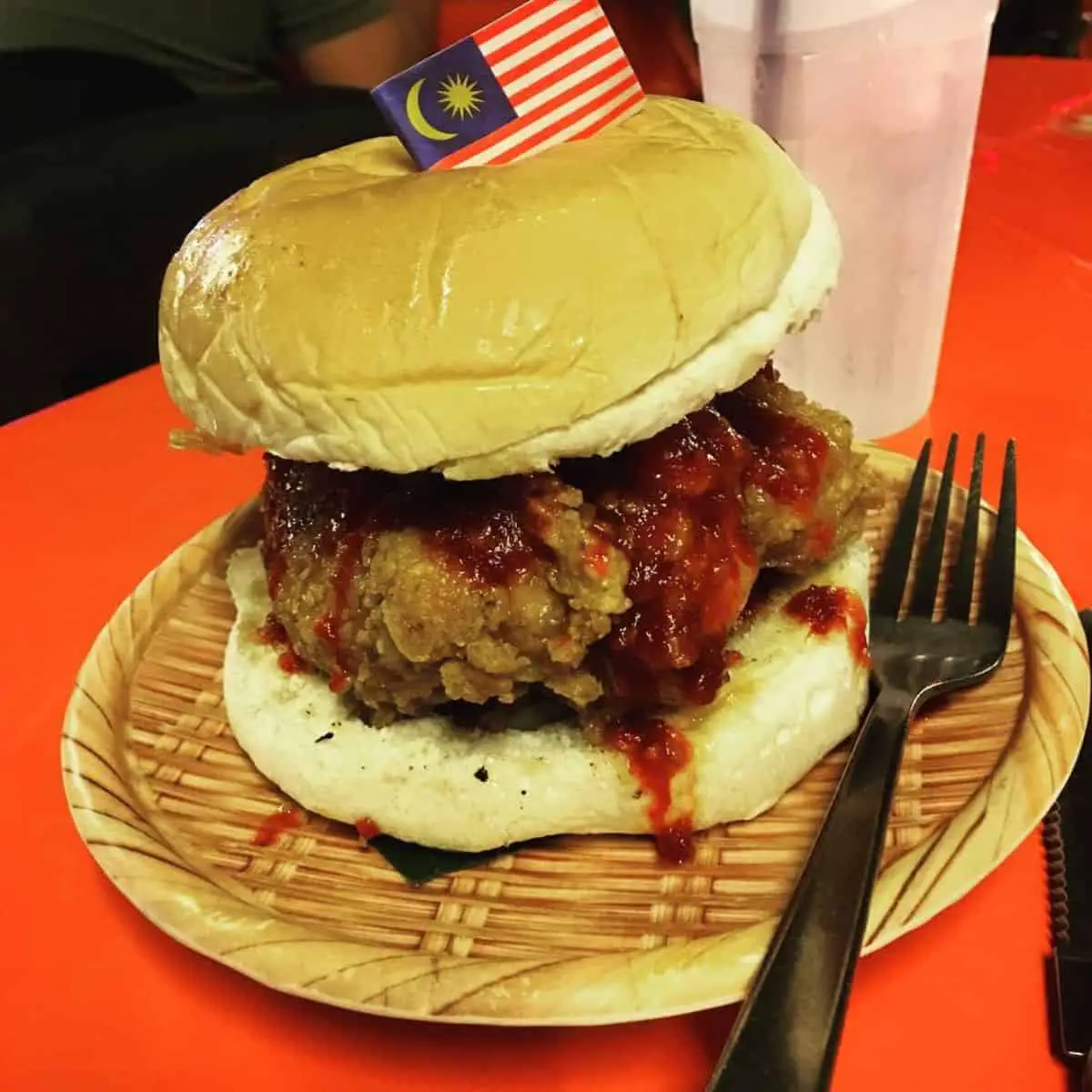 Nasi Lemak Burger dripping in sambal sauce and decorated with Malaysian flag from Uncle Lanz