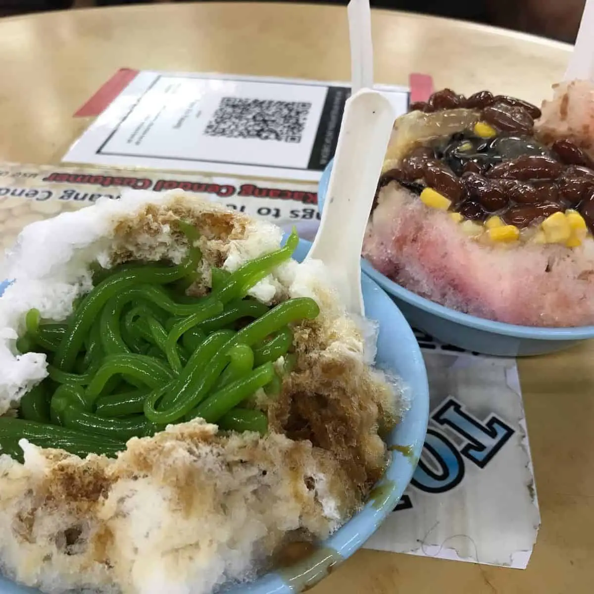 The famous dessert servings from Tony Ais Kacang in light blue bowls