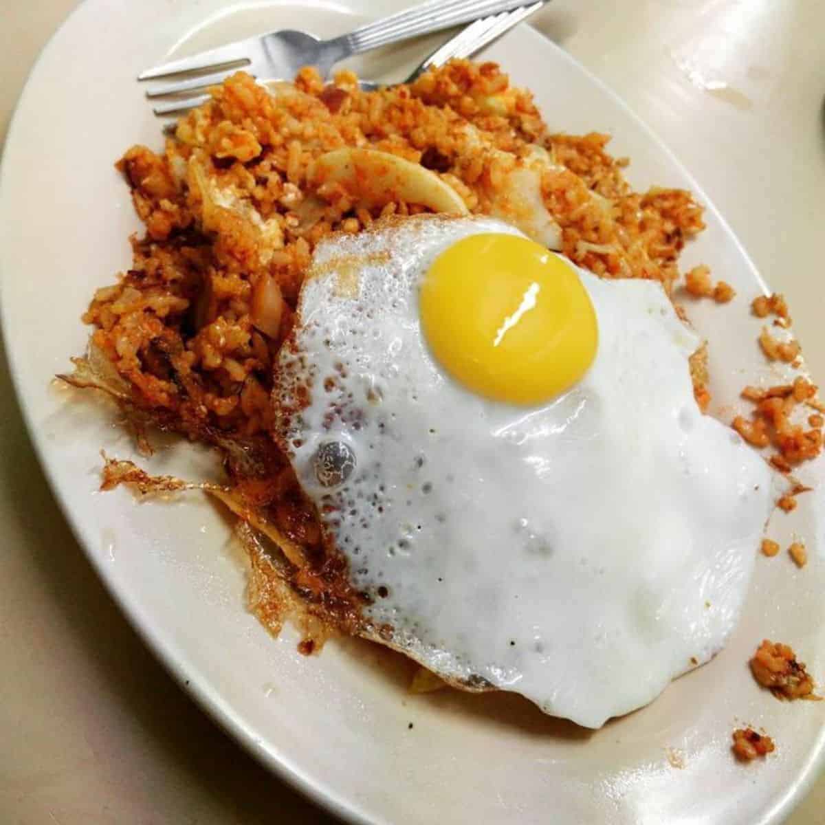 The famous Nasi Lemak Goreng by Ali Mamak served in a white plastic plate