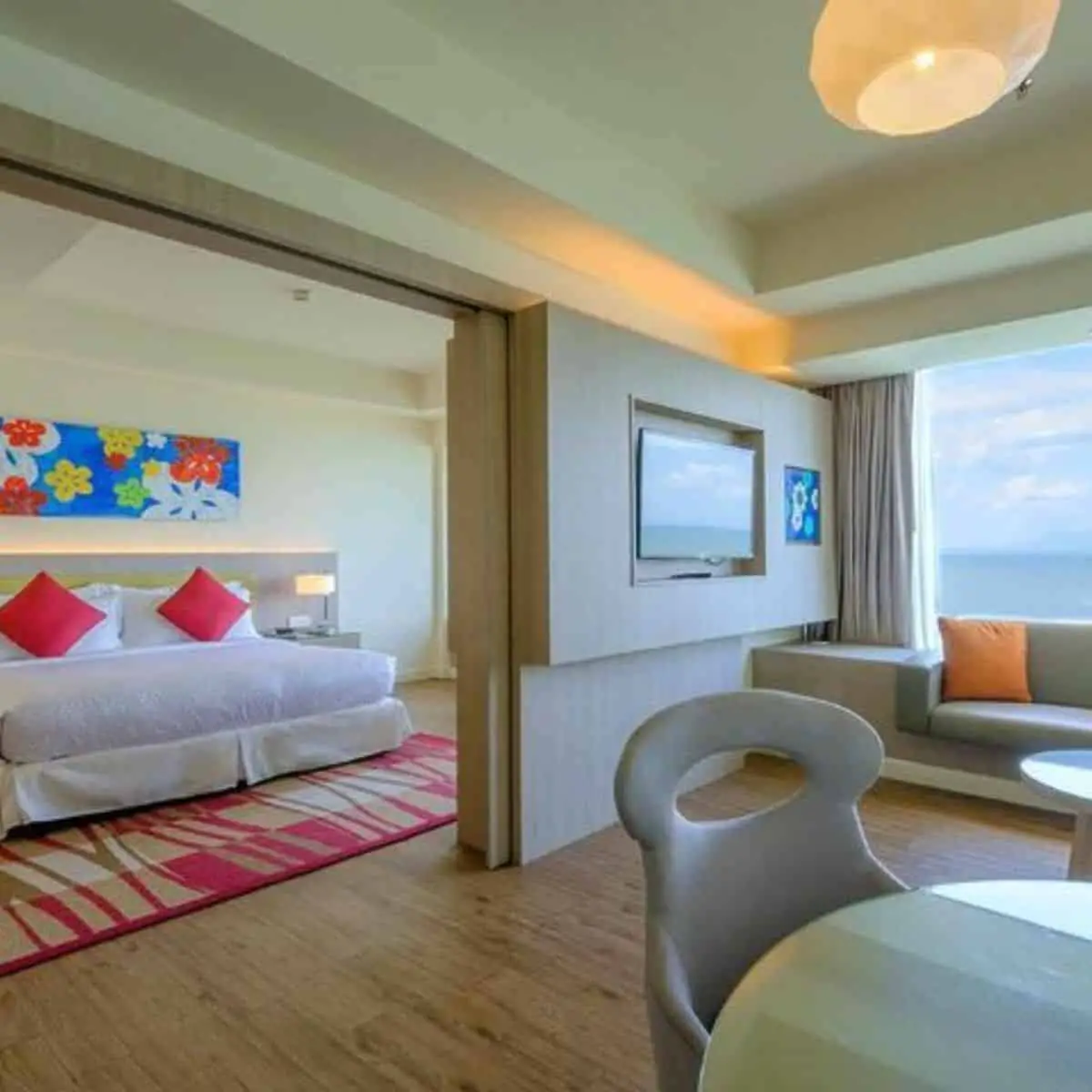 Cool and calming setting of family suite room with beach view in the windows