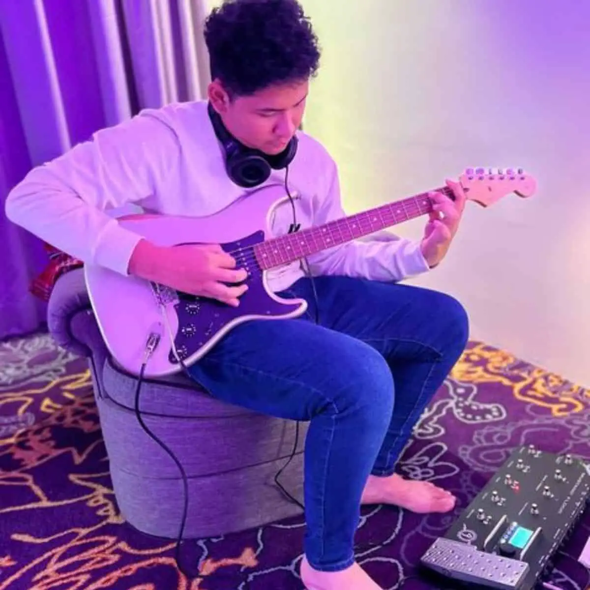 Playing guitar in Hard Rock Hotel room