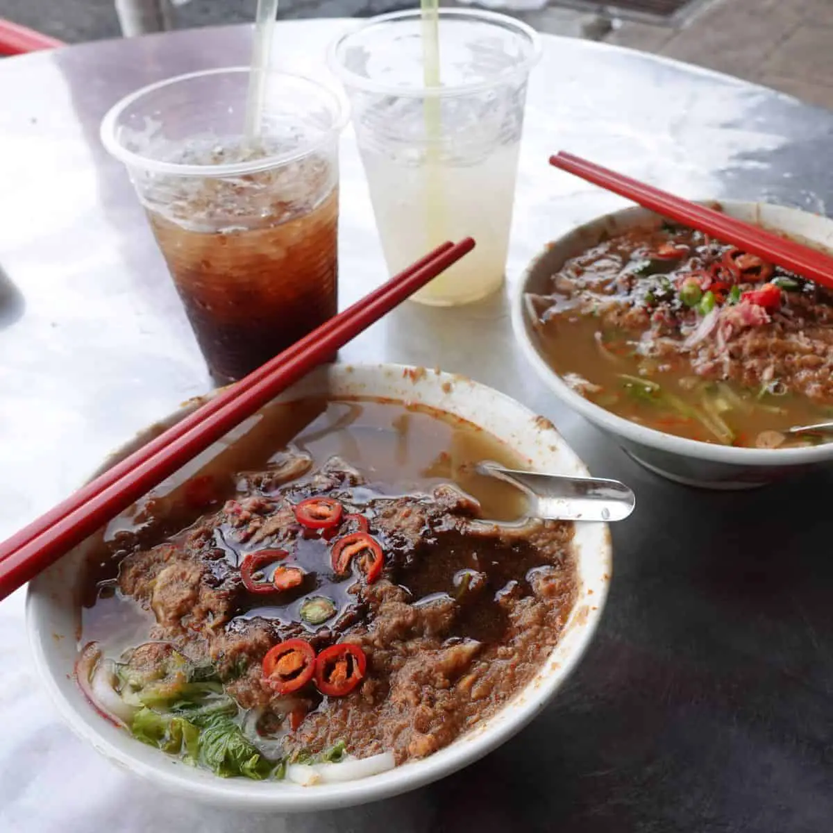 Assam laksa air itam two bowls street food in Penang