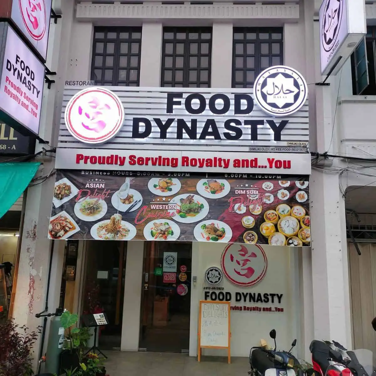 Food Dynasty restaurant photo with a hanging tarpaulin of menu