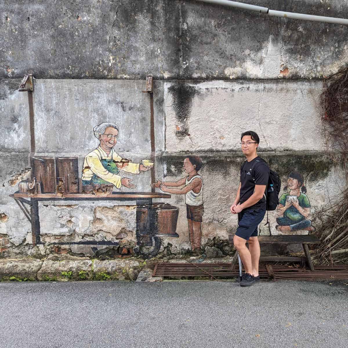 Georgetown street art Ruiz grandmother giving food