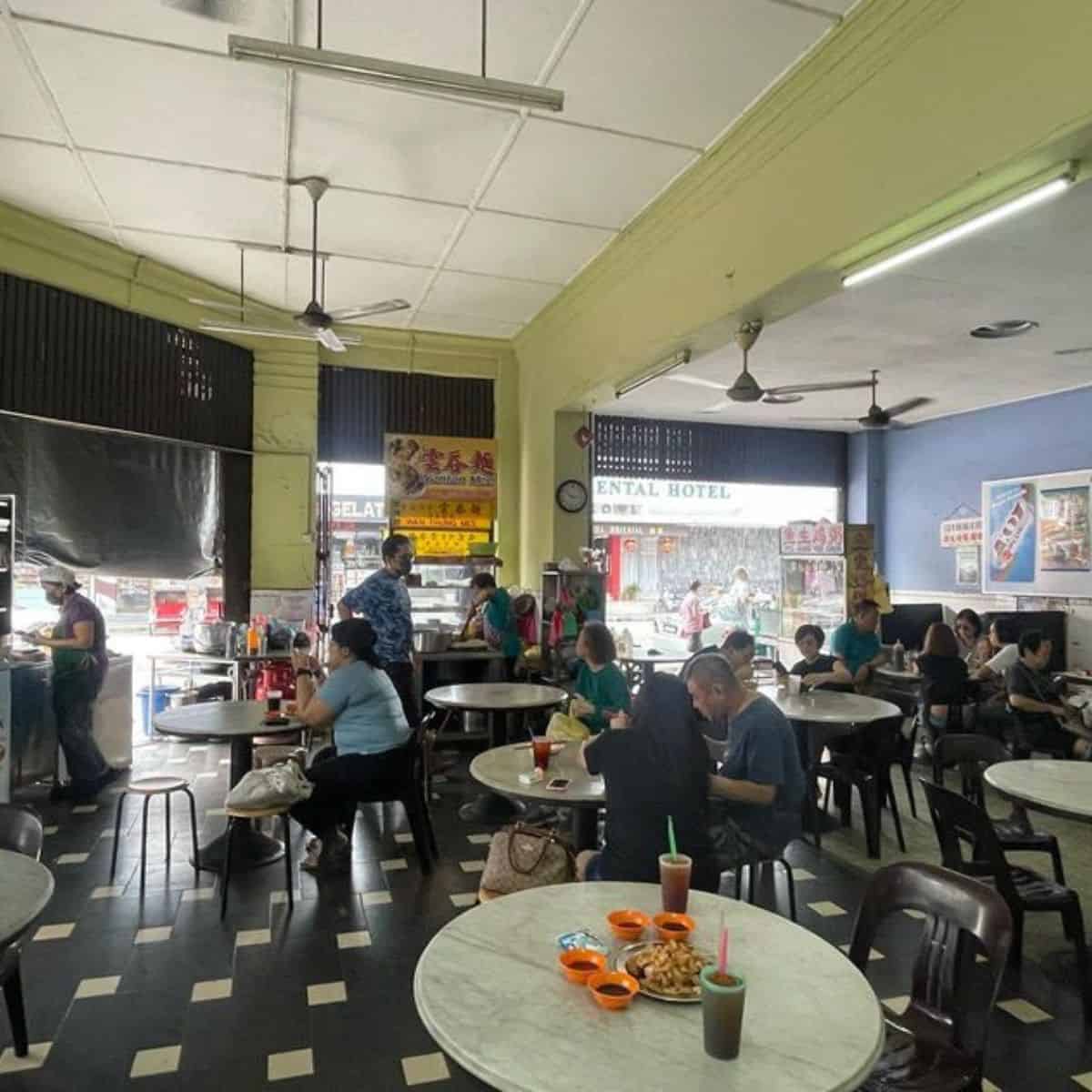 Kheng Pin Kopitiam with Penang diners eating their food and sipping their coffee