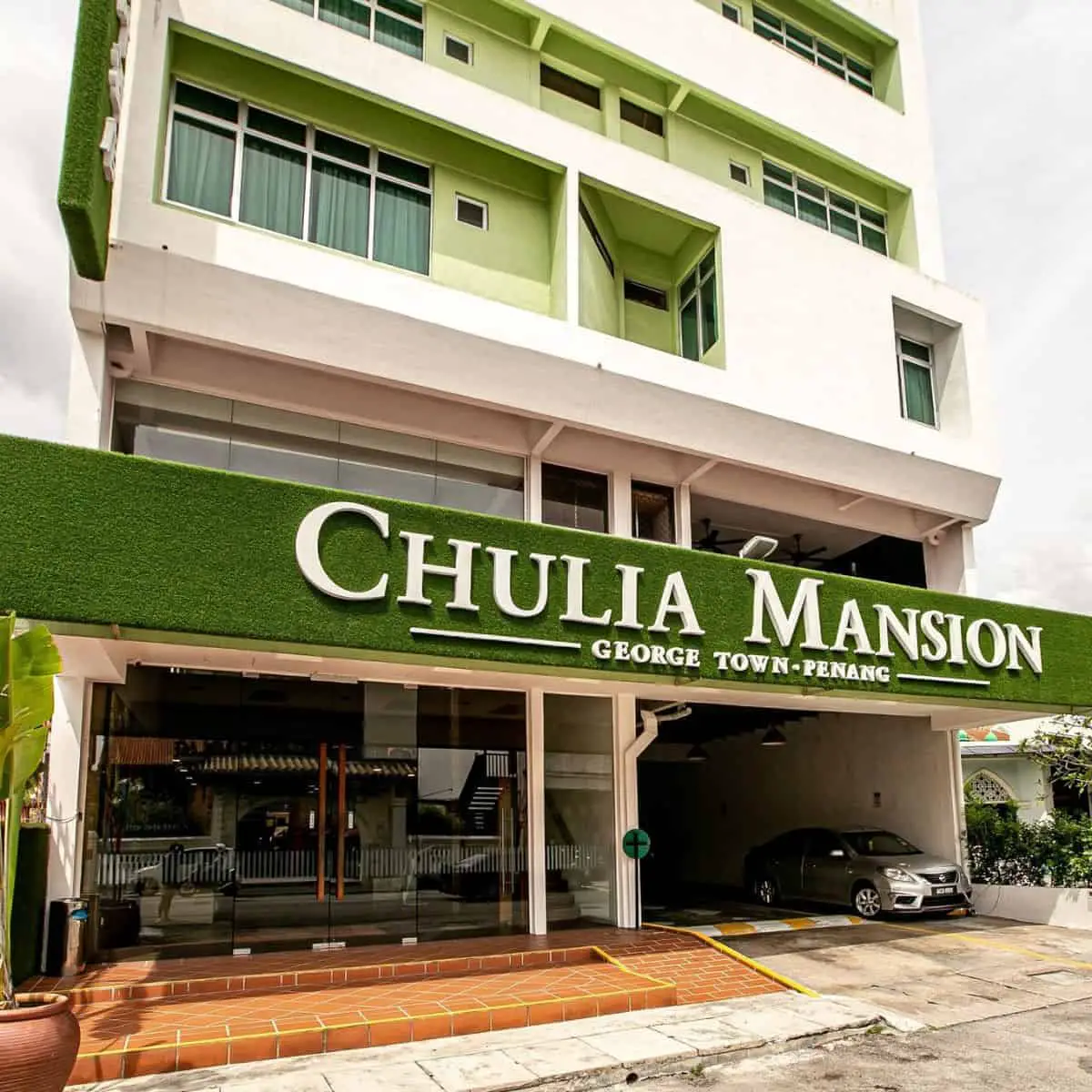 Chulia Mansion front view of the building with green paint
