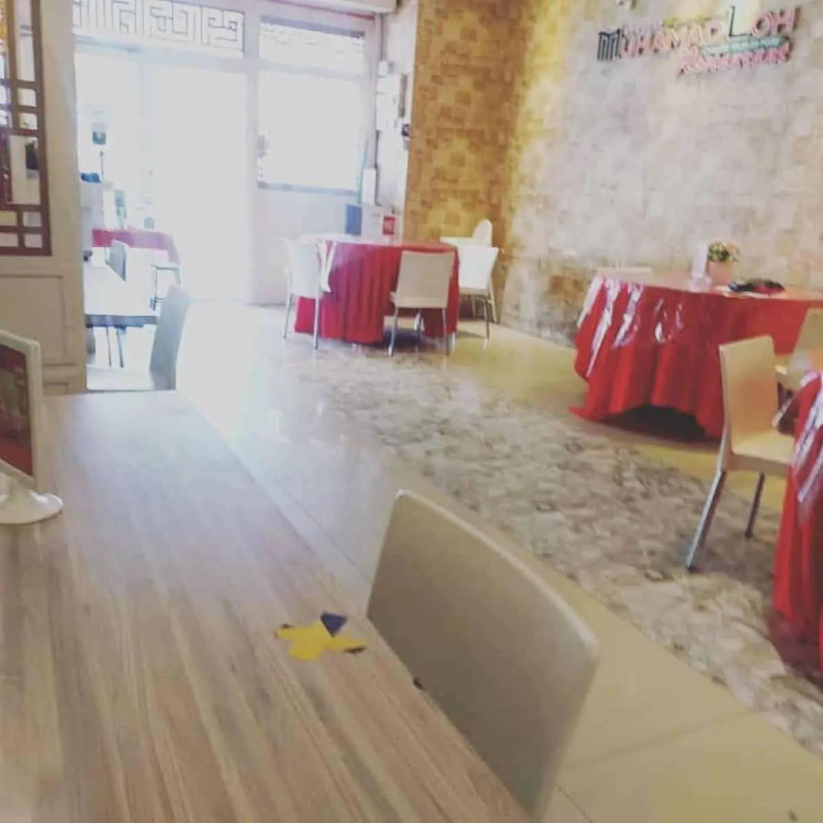 Chinese Muslim restaurant in Penang with a relaxed atmosphere and empty red tables