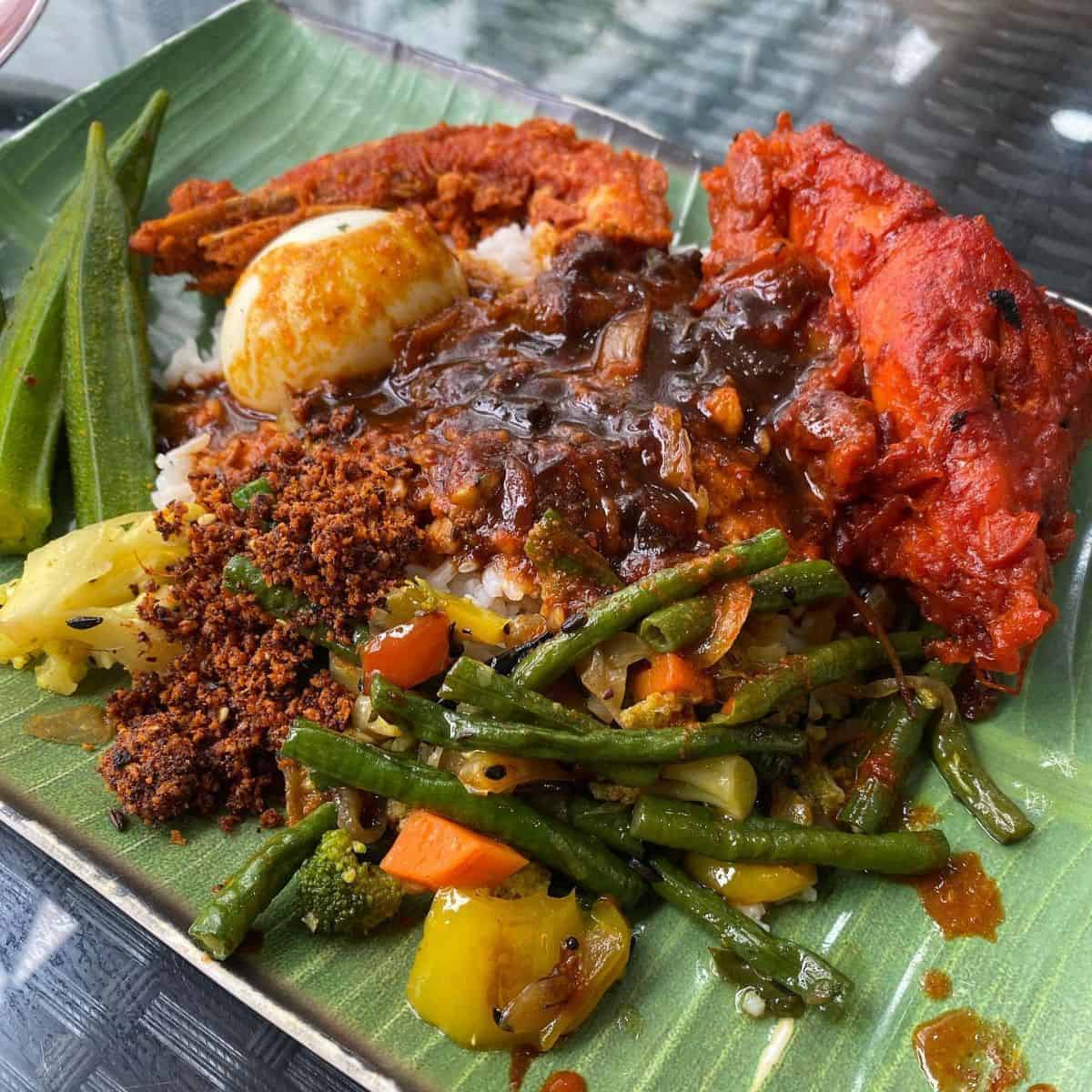 The savoury Nasi Kandar in a banana leaf plate from Kayu Nasi Kandar