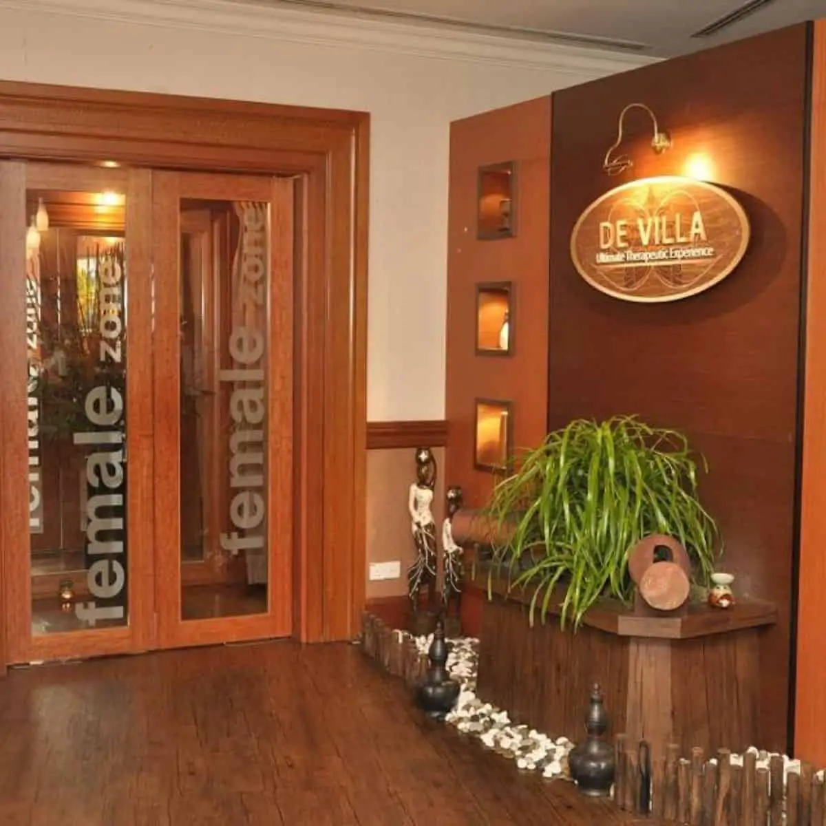 De Villa Penang Spa lounge area with a woody massage treatment interior