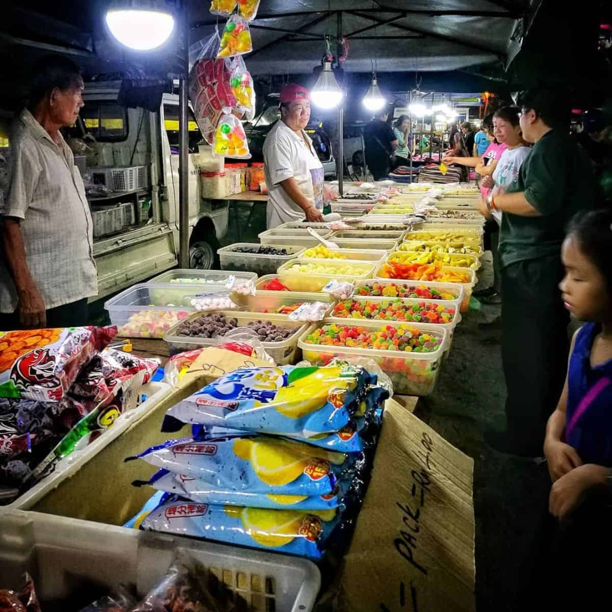 Colourful dessert on display with customers taking orders