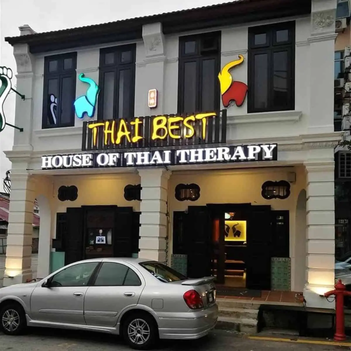 Thai Best front view building with a parked car