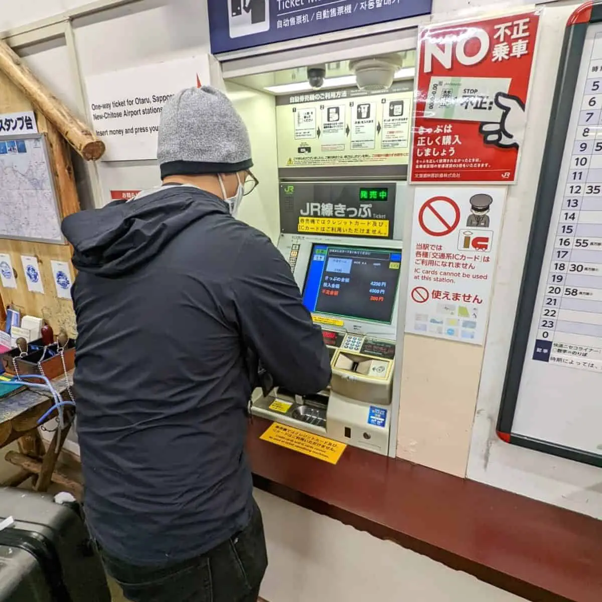 Buying Japanese train tickets at booth