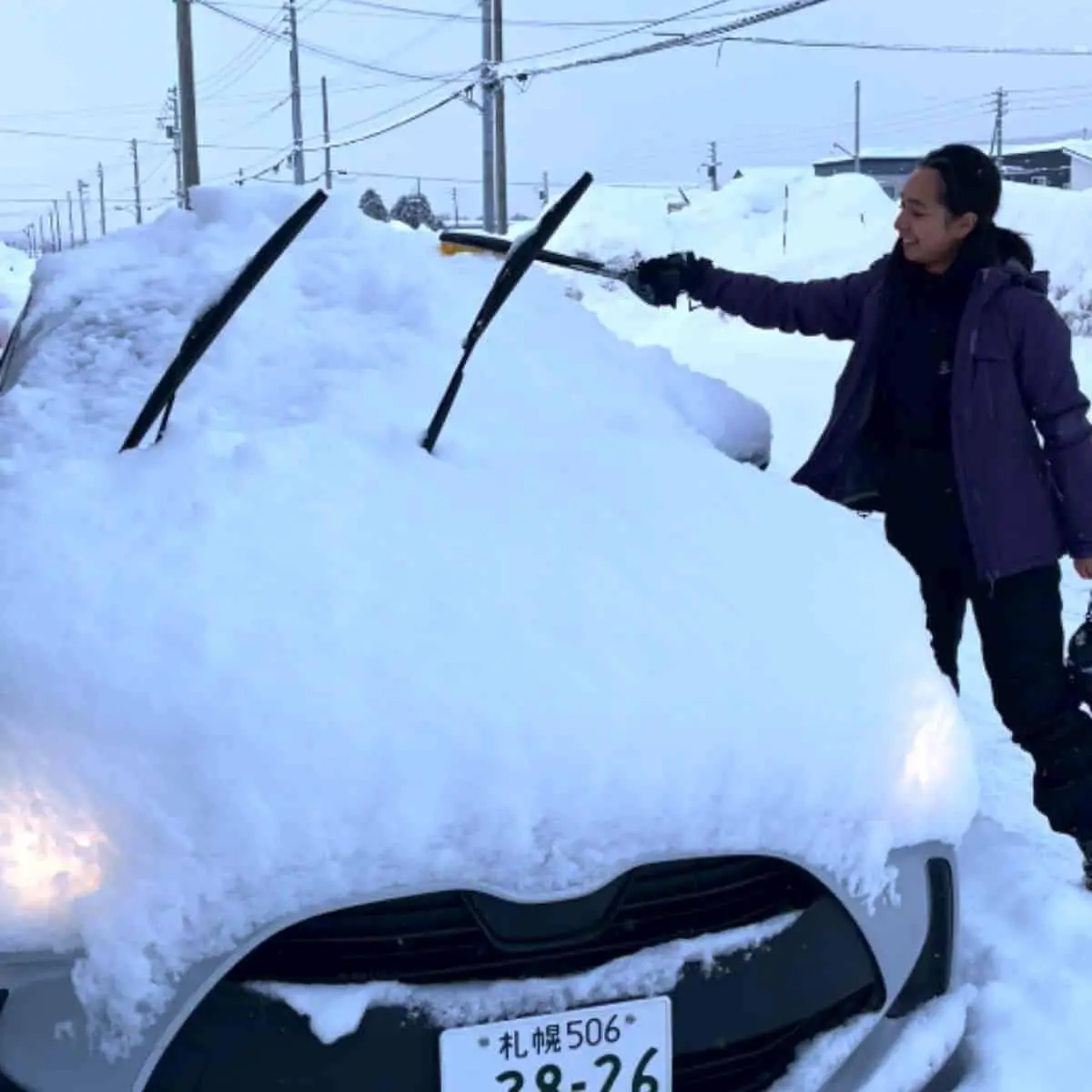 Snow covered car Niseko