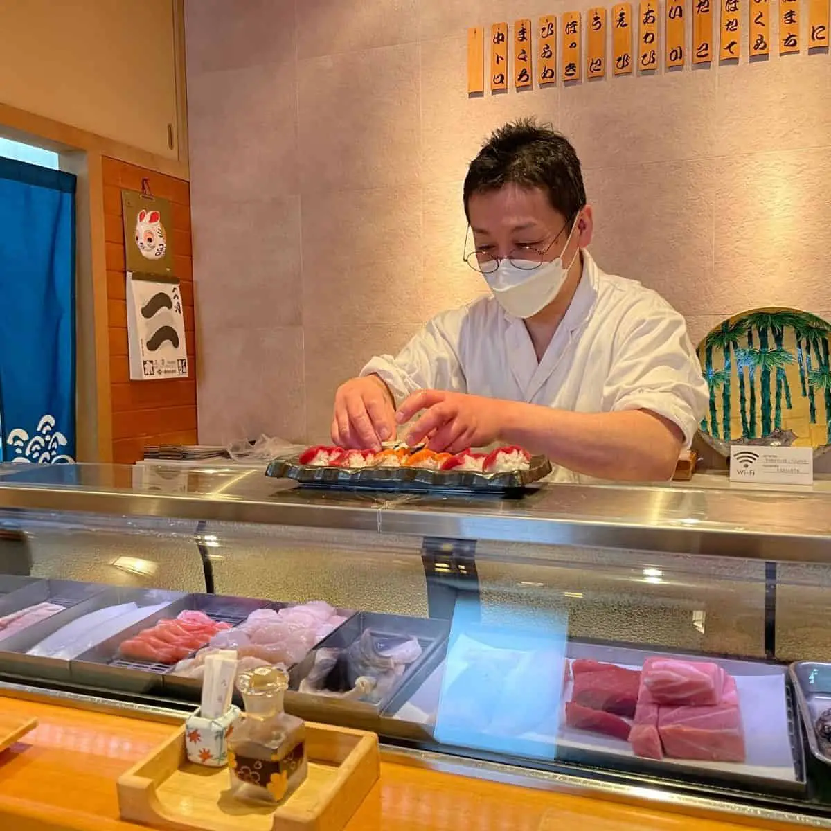 Takesushi chef preparing sushi
