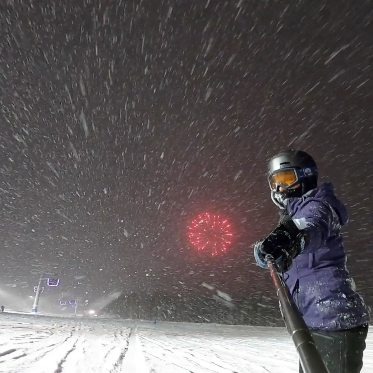Fireworks while snowboarding at night